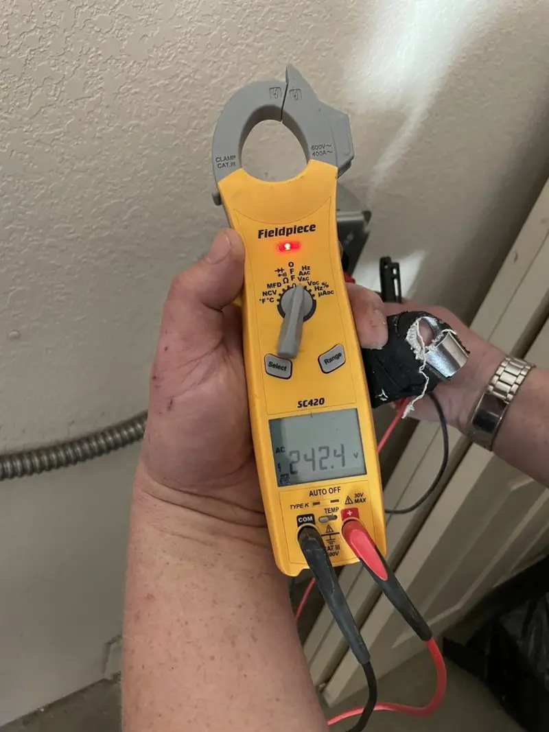 Voltage testing with clamp meter during Outlet Installation in Vallejo